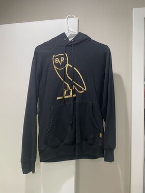 Black Hoodie with Gold Owl Emblem